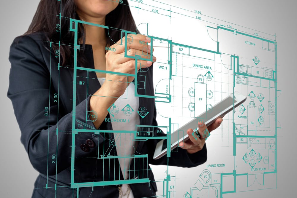 stock-photo-businesswoman-architect-interior-designer-working-with-modern-futuristic-virtual-layout-home-657523123
