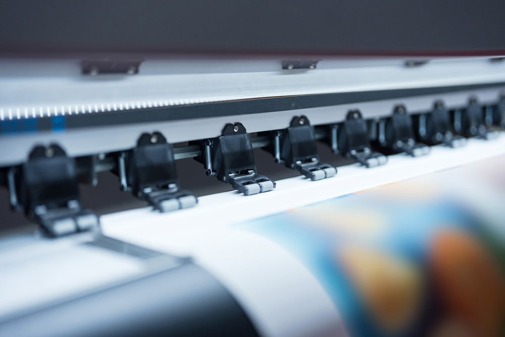 stock-photo-close-up-of-large-format-printer-heads-in-action-detailed-view-of-modern-large-format-printer-2443027291