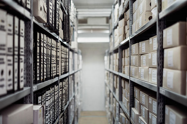 Archive aisle with folders on shelves