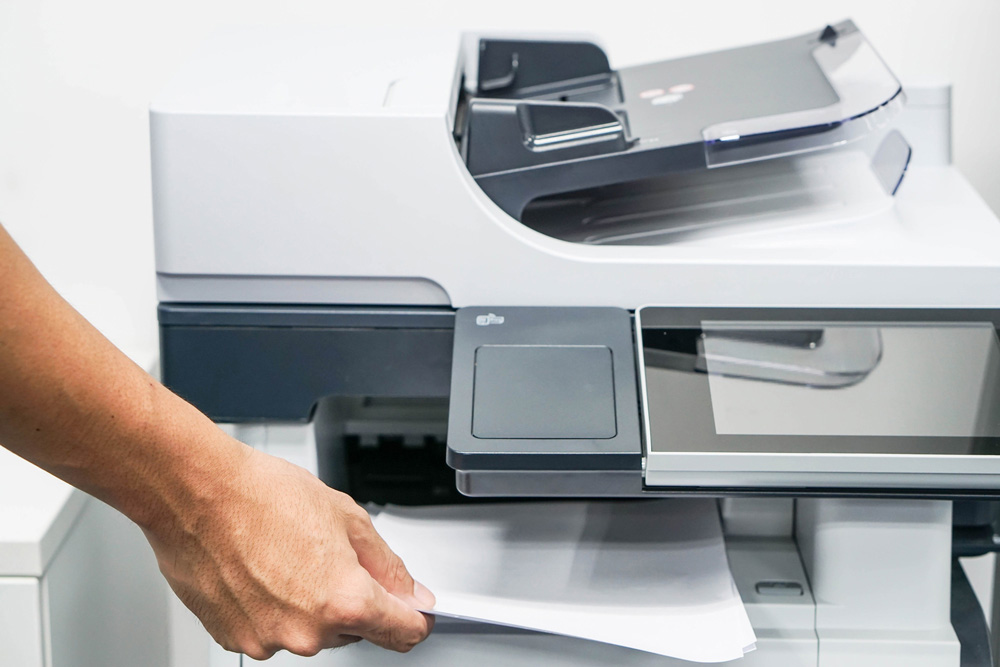 stock-photo-close-up-printing-and-copying-a-document-in-the-office-445947805