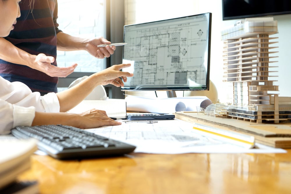 stock-photo-engineer-or-architectural-project-two-engineering-or-architecture-discussing-and-working-on-1151634602