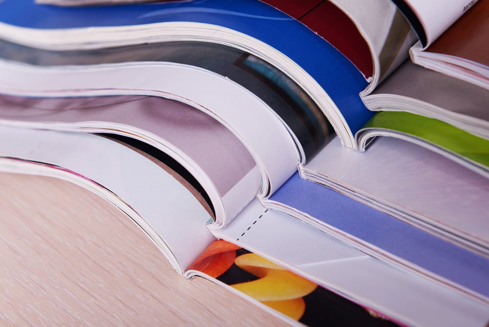 stock-photo-post-press-finishing-line-machine-cutting-trimming-paperback-and-binding-602183411